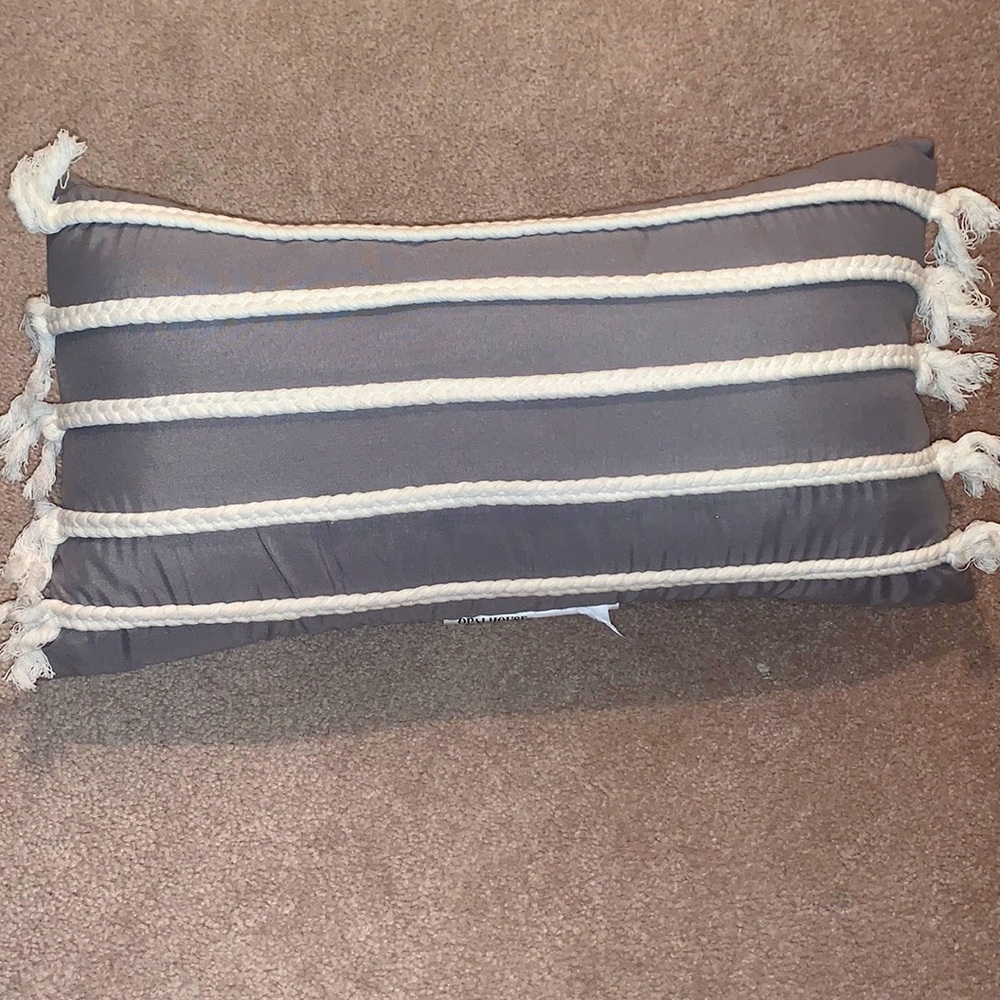 Grey and white decorative pillow